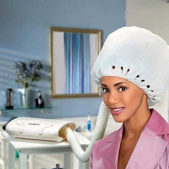 girl using bonnet hair dryer
